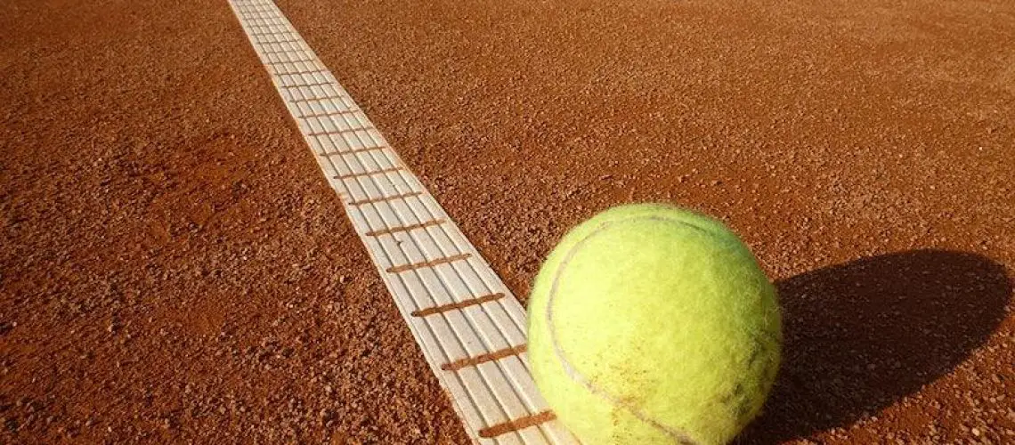 Tennis ball on court. Free public domain CC0 photo.
